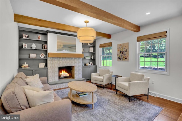 1420 Valley Rd, Lancaster, PA 17603 - living room featuring beamed ceiling, a warm lit fireplace, wood finished floors, and recessed lighting