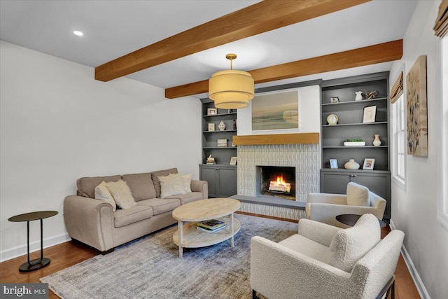 1420 Valley Rd, Lancaster, PA 17603 - living room featuring beam ceiling, a lit fireplace, wood finished floors, and recessed lighting