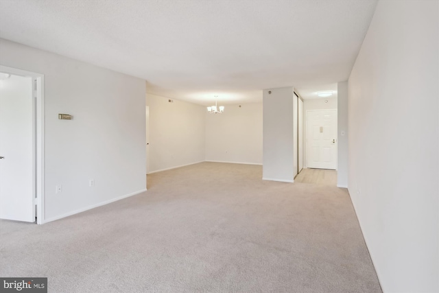 15115 Interlachen Dr Unit 3-415, Silver Spring, MD 20906 - empty room featuring light carpet and a chandelier