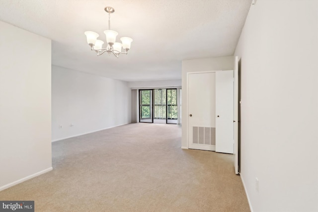15115 Interlachen Dr Unit 3-415, Silver Spring, MD 20906 - empty room with light carpet and a chandelier