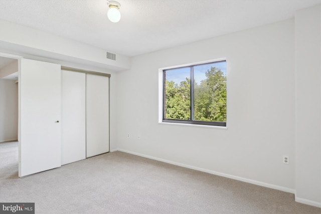 15115 Interlachen Dr Unit 3-415, Silver Spring, MD 20906 - unfurnished bedroom featuring light carpet and a closet