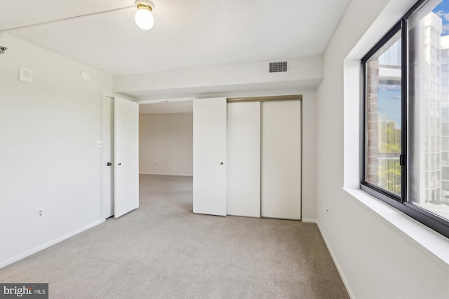 15115 Interlachen Dr Unit 3-415, Silver Spring, MD 20906 - unfurnished bedroom with carpet floors, multiple windows, and a closet