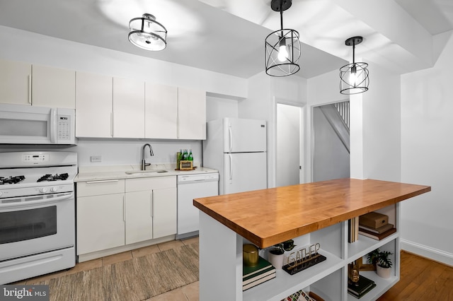 3718 Yolando Rd, Baltimore, MD 21218 - kitchen with white appliances, wood counters, decorative light fixtures, and white cabinetry