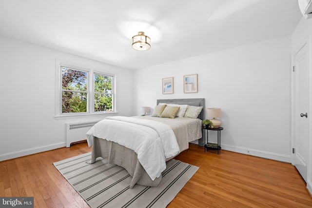 3718 Yolando Rd, Baltimore, MD 21218 - bedroom featuring radiator and light wood-style floors
