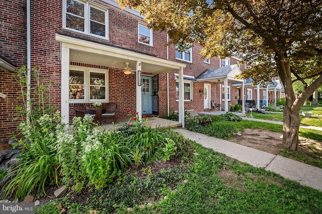 3718 Yolando Rd, Baltimore, MD 21218 - townhome / multi-family property featuring brick siding, a porch, and ceiling fan