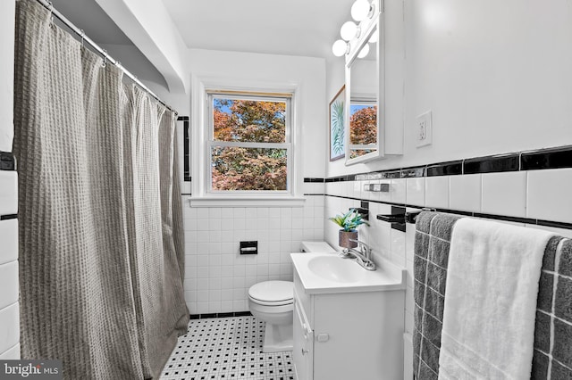3718 Yolando Rd, Baltimore, MD 21218 - bathroom with vanity, tile walls, a wainscoted wall, and curtained shower