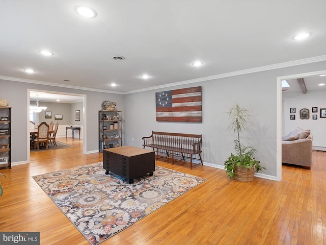 451 E Lafayette Dr, West Chester, PA 19382 - living area with recessed lighting, wood finished floors, crown molding, and a chandelier
