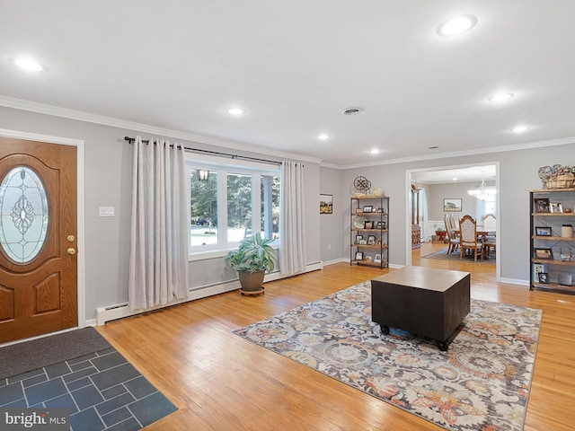 451 E Lafayette Dr, West Chester, PA 19382 - living area with ornamental molding, light wood-type flooring, recessed lighting, baseboard heating, and a chandelier