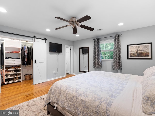 451 E Lafayette Dr, West Chester, PA 19382 - bedroom featuring wood finished floors, recessed lighting, a spacious closet, a barn door, and a ceiling fan