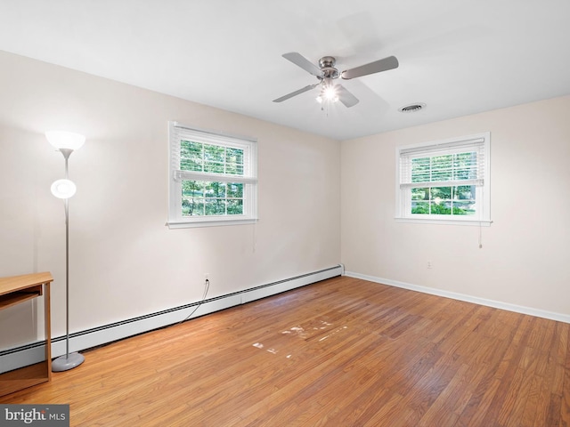 451 E Lafayette Dr, West Chester, PA 19382 - empty room with plenty of natural light, wood finished floors, baseboard heating, and ceiling fan
