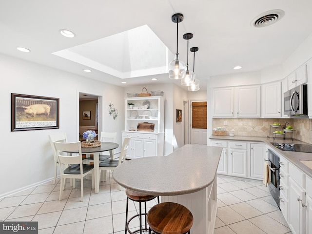 451 E Lafayette Dr, West Chester, PA 19382 - kitchen featuring black appliances, light tile patterned flooring, decorative backsplash, white cabinets, and recessed lighting