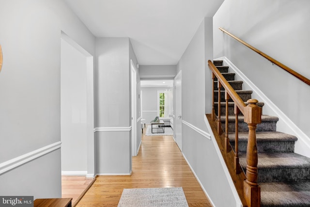 10110 Sassafras Woods Ct, Burke, VA 22015 - stairway with wood finished floors and baseboards