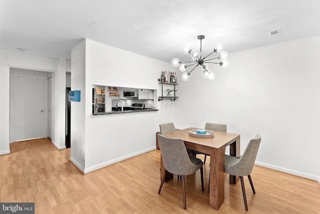 6900 Mary Caroline Cir Unit L, Alexandria, VA 22310 - dining room with a chandelier and wood finished floors
