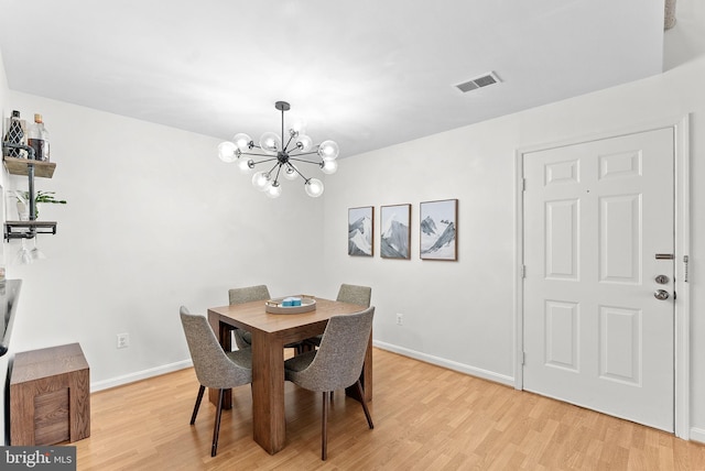 6900 Mary Caroline Cir Unit L, Alexandria, VA 22310 - dining room with a chandelier and light wood-style floors