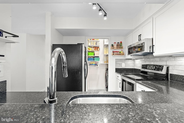 6900 Mary Caroline Cir Unit L, Alexandria, VA 22310 - kitchen with appliances with stainless steel finishes, open shelves, dark stone countertops, white cabinets, and tasteful backsplash