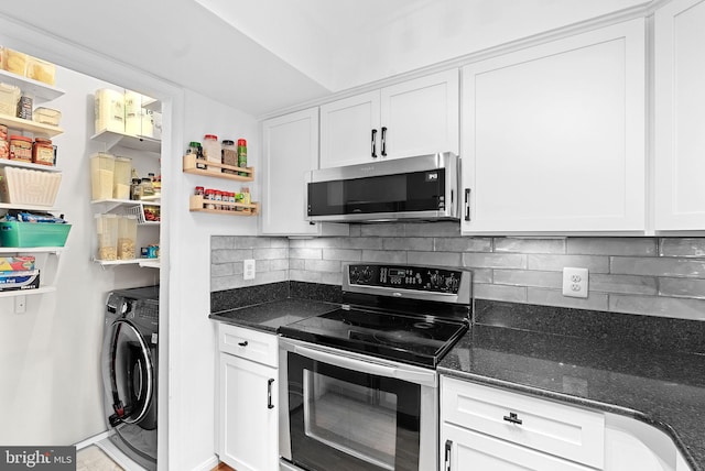 6900 Mary Caroline Cir Unit L, Alexandria, VA 22310 - kitchen featuring stainless steel appliances, washer / clothes dryer, white cabinets, decorative backsplash, and dark stone countertops