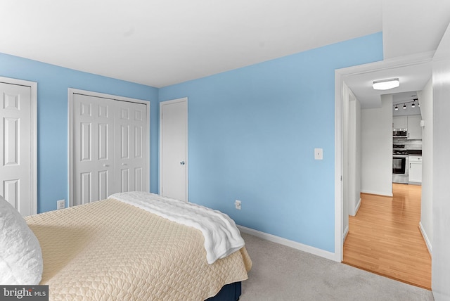 6900 Mary Caroline Cir Unit L, Alexandria, VA 22310 - bedroom with baseboards and light carpet