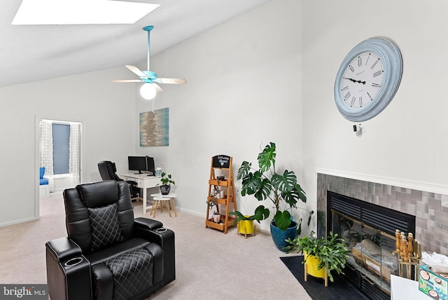 6900 Mary Caroline Cir Unit L, Alexandria, VA 22310 - living area with carpet, lofted ceiling, a skylight, a tile fireplace, and a ceiling fan