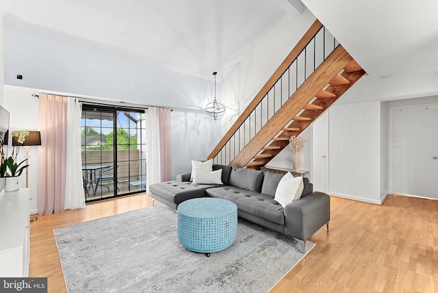 6900 Mary Caroline Cir Unit L, Alexandria, VA 22310 - living area featuring stairway, wood finished floors, and a chandelier