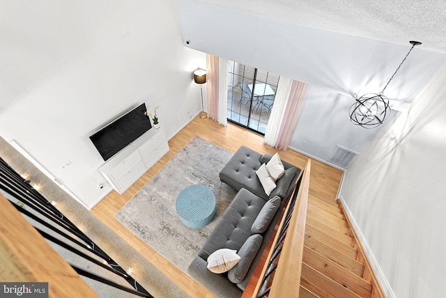 6900 Mary Caroline Cir Unit L, Alexandria, VA 22310 - living area featuring wood finished floors and a chandelier