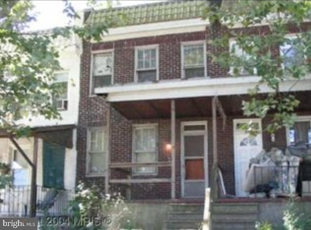 2830 Waterview Ave, Baltimore, MD 21230 - townhome / multi-family property featuring covered porch and brick siding