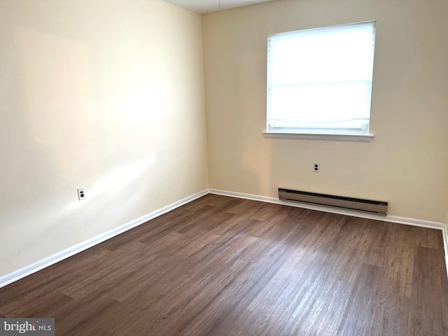 768D Hudson Pkwy, Manchester Twp, NJ 08759 - spare room with baseboard heating and dark wood-style flooring
