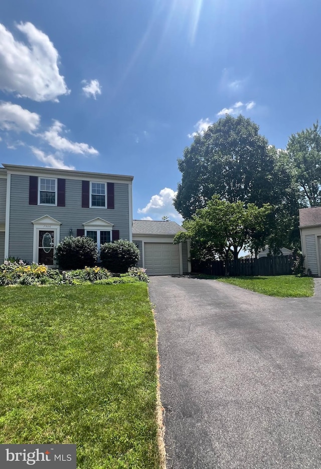 7506 Filbert Ter, Gaithersburg, MD 20879 - colonial house featuring asphalt driveway and an attached garage