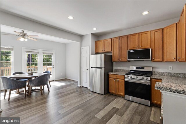 12749 Stone Lined Cir, Woodbridge, VA 22192 - kitchen with stainless steel appliances, recessed lighting, dark wood-type flooring, ceiling fan, and brown cabinetry