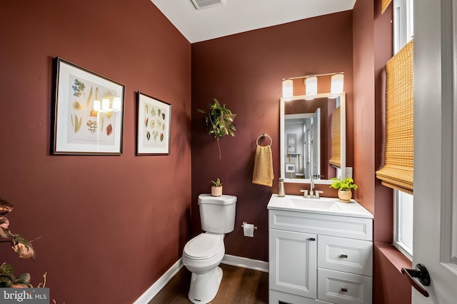 1309 Old Coldspring Ln W, Baltimore, MD 21211 - bathroom featuring vanity and wood finished floors