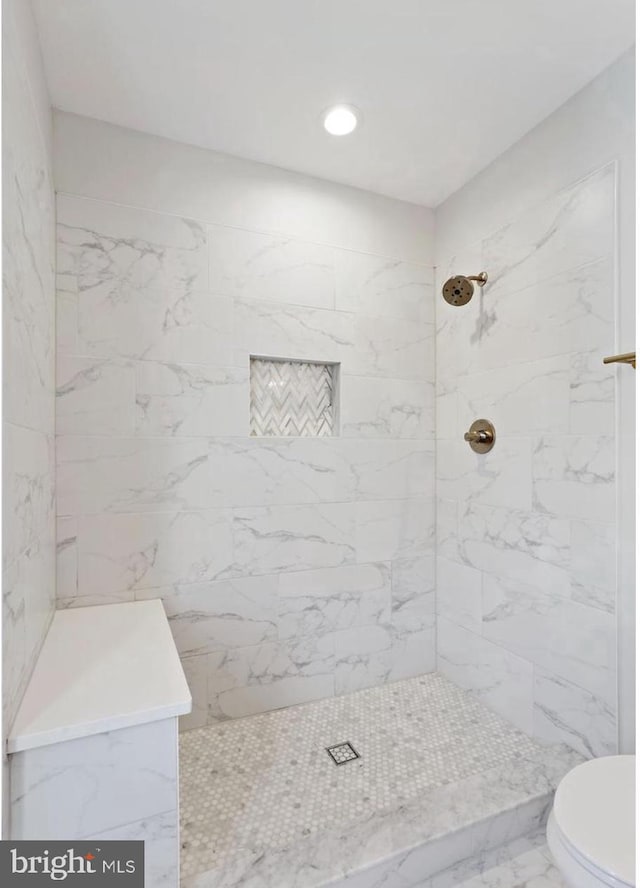 1309 Old Coldspring Ln W, Baltimore, MD 21211 - full bath featuring tiled shower, marble look tiles, and recessed lighting