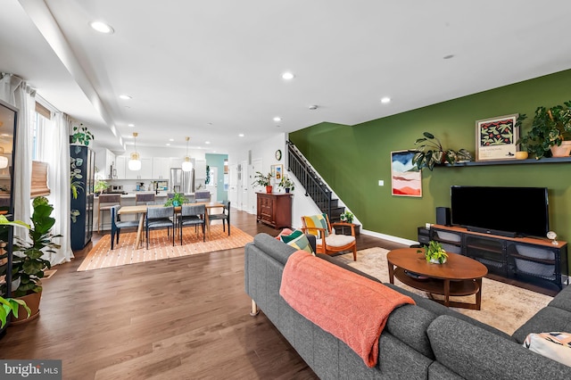 1309 Old Coldspring Ln W, Baltimore, MD 21211 - living area with wood finished floors, recessed lighting, and stairs