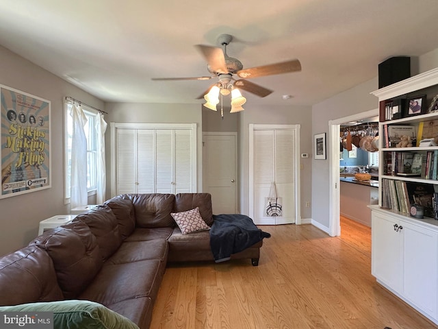 5512 Sefton Ave, Baltimore, MD 21214 - living area with ceiling fan and light wood-type flooring