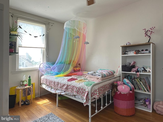 5512 Sefton Ave, Baltimore, MD 21214 - bedroom with wood finished floors and multiple windows