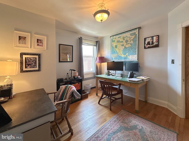 5512 Sefton Ave, Baltimore, MD 21214 - office area with light wood-type flooring and radiator