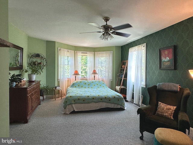 5512 Sefton Ave, Baltimore, MD 21214 - bedroom with carpet floors, wallpapered walls, and ceiling fan