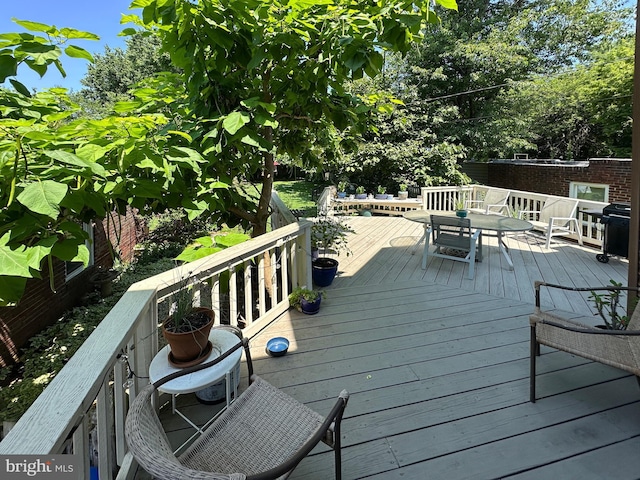 5512 Sefton Ave, Baltimore, MD 21214 - wooden terrace with outdoor dining space and area for grilling