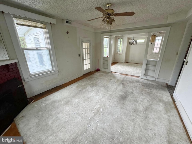 2805 Oakley Ave, Baltimore, MD 21215 - unfurnished living room featuring a ceiling fan, a textured ceiling, and carpet floors