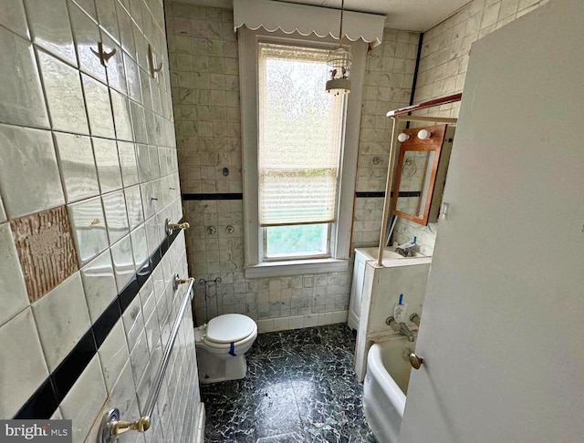 2805 Oakley Ave, Baltimore, MD 21215 - full bathroom with tile walls, a bathtub, and marble finish flooring