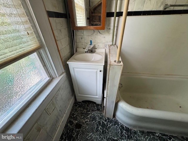 2805 Oakley Ave, Baltimore, MD 21215 - full bathroom with a tub, marble finish flooring, and vanity