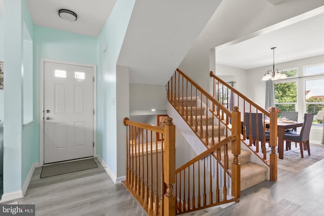 33 S Cummings Dr, Middletown, DE 19709 - foyer featuring a chandelier, wood finished floors, and stairway