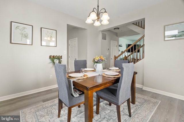 33 S Cummings Dr, Middletown, DE 19709 - dining room with a chandelier, wood finished floors, and stairs
