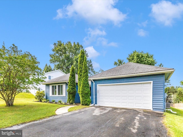 12004 Cheyenne Rd, Gaithersburg, MD 20878 - view of front of home with a front lawn, a detached garage, and a shingled roof
