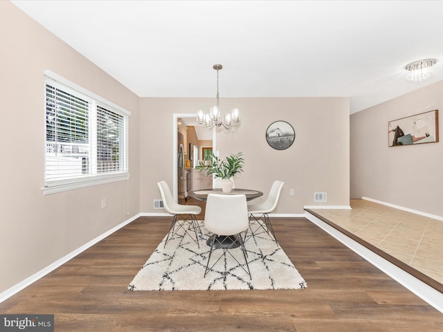 12004 Cheyenne Rd, Gaithersburg, MD 20878 - dining room featuring a chandelier and dark wood finished floors