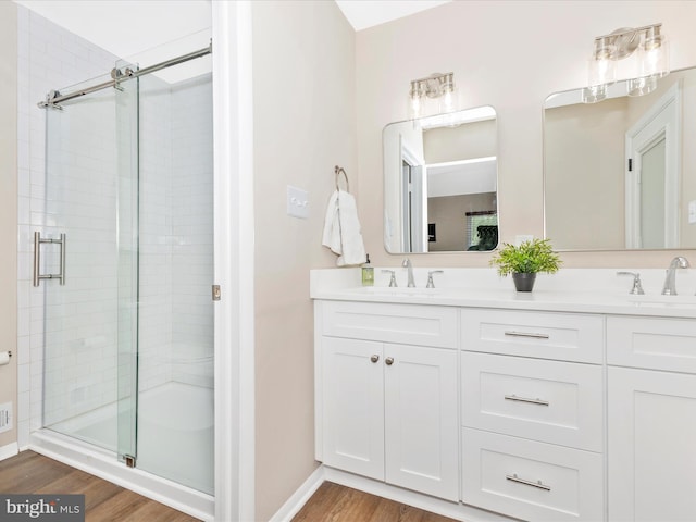 12004 Cheyenne Rd, Gaithersburg, MD 20878 - full bath featuring a stall shower, wood finished floors, and double vanity