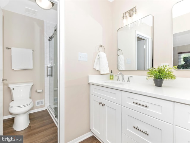 12004 Cheyenne Rd, Gaithersburg, MD 20878 - bathroom with vanity, a stall shower, and wood finished floors