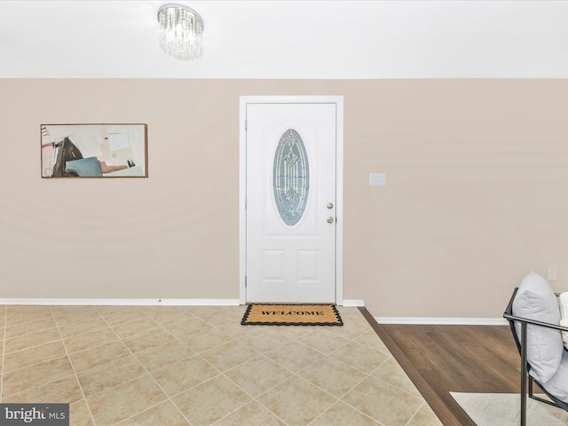 12004 Cheyenne Rd, Gaithersburg, MD 20878 - foyer featuring baseboards and a chandelier