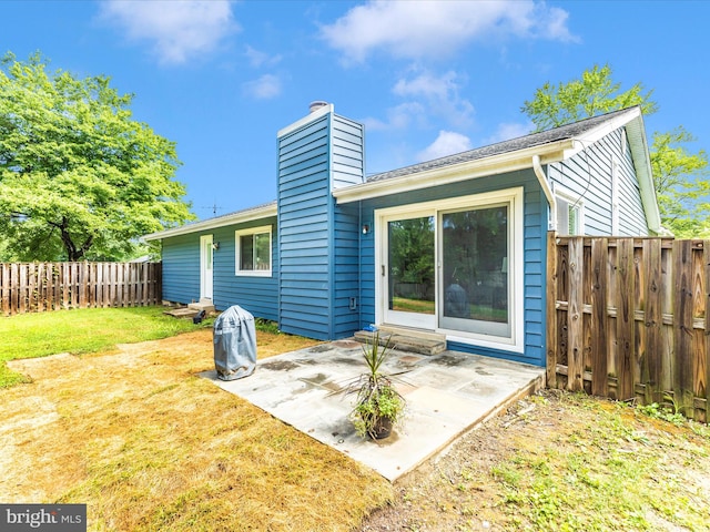 12004 Cheyenne Rd, Gaithersburg, MD 20878 - rear view of property featuring a chimney, a patio, and a fenced backyard