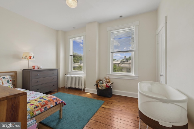3301 Beech Ave, Baltimore, MD 21211 - bedroom featuring radiator and wood-type flooring