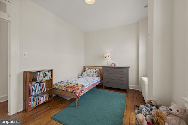 3301 Beech Ave, Baltimore, MD 21211 - bedroom featuring wood-type flooring and radiator