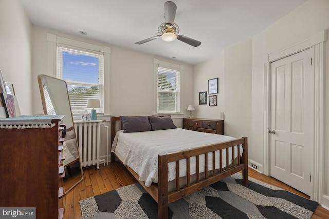 3301 Beech Ave, Baltimore, MD 21211 - bedroom featuring radiator, wood-type flooring, and a ceiling fan